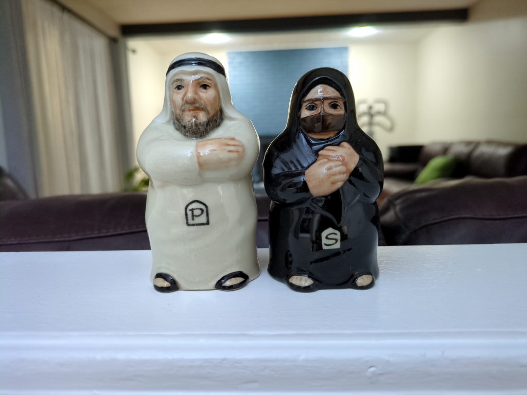 Salt and pepper shakers in the style of Emirati traditional dress